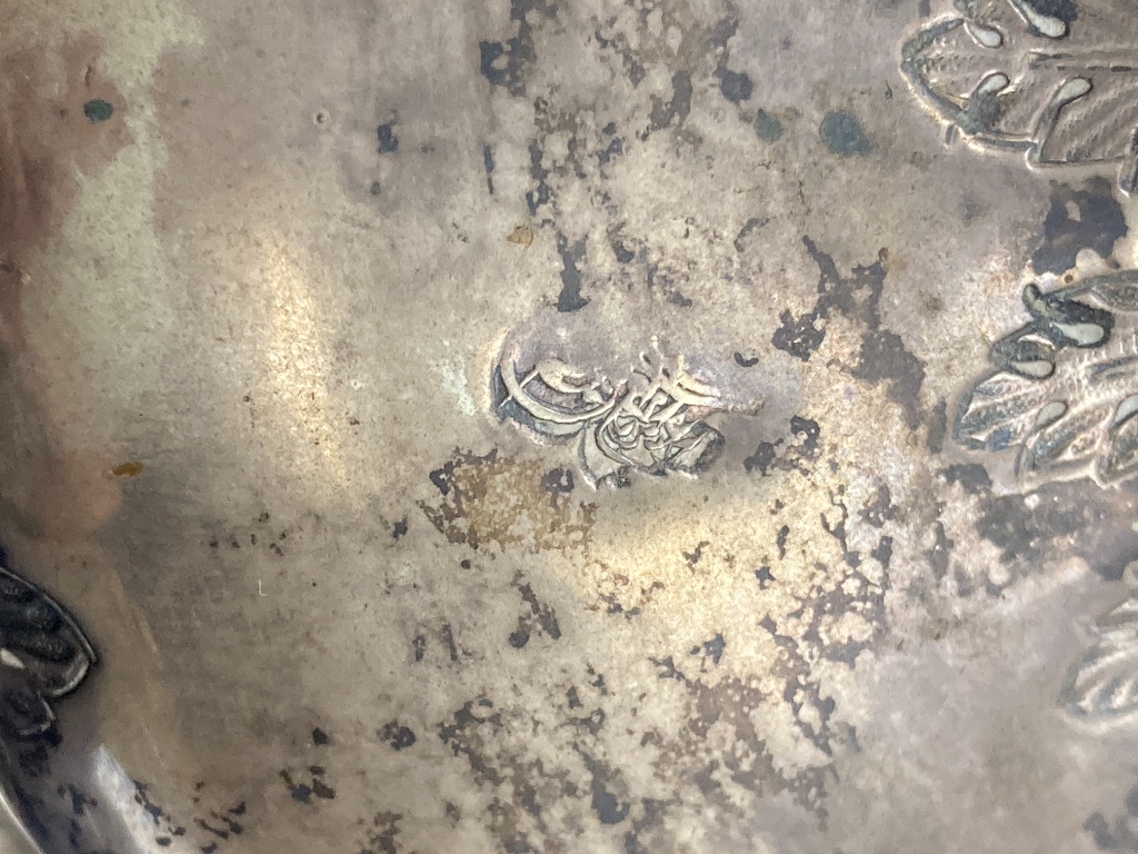 A Persian engraved white metal baluster flagon